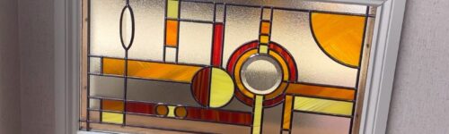 Mackintosh Renfrew Range overlay stained glass panel in a white frame, made for a kitchen serving hatch in Southampton
