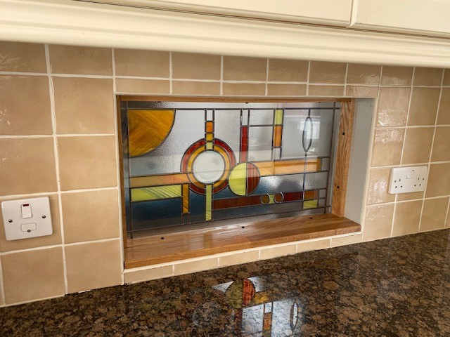 Mackintosh Renfrew overlay stained glass panel fitted in a kitchen serving hatch, Southampton